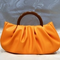 Chic orange cloud pouch bag with brown resin ring handle and pleated PU leather texture - Orange