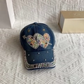 Detail of a dark blue denim baseball cap with sparkling rhinestone double heart and studs - Adult, Adjustable / Denim Blue Arrow Through Hearts