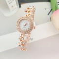 Detailed view of rose gold quartz watch featuring swan-shaped bracelet and crystal inlay - Rose Gold