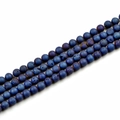 Macro detail of 10mm matte dark blue natural stone beads for DIY jewelry making - Electroplated Blue
