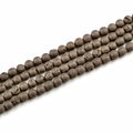Macro view of 10mm matte bronze lava stone round beads for jewelry making - Electroplated Coffee