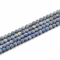 Dettaglio di perle in pietra naturale blu da 10mm con trama rocciosa per gioielli fai-da-te - Acqua