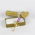Detailed view of a purple crystal rose in an open gold heart box with white ribbon - Gold Stem Purple Rose