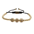 Detail of adjustable black woven cord bracelet with gold beads and sparkling zircon charms - Gold