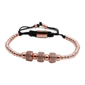 Detail of rose gold beaded bracelet with zircon-encrusted charms and adjustable cord - Rose Gold