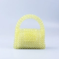Handgefertigte gelbe Perlenhandtasche in Trapezform mit rundem Griff im Minimal-Stil - Gelb