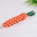 Handwoven cotton rope carrot dog toy for pet teething and cleaning on white wood - Carrot