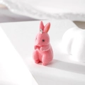 Close-up of pink flocked rabbit pendant with silver metal ring for DIY jewelry making - Rabbit