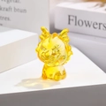 Macro shot of a translucent amber dragon glass figurine as a minimalist desk ornament - Zodiac Dragon / Gold Yellow