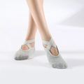 Grey yoga socks for women with elastic criss-cross straps and anti-slip cotton grip - One Size / Light Gray