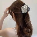 Detailed back view of a woman wearing a black and white camellia flower hair claw clip - Hair Claw / White