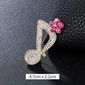 Golden musical note brooch with white rhinestones and pink flower detail, size 4.7cm x 2.2cm - Pink Flower Music Note Gold (XD9423)