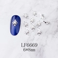 Detail showing 6x8mm silver octagonal star nail charm with white pearl on marble - Silver Hollow Octagonal Star Pearl (6669)