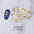 Macro shot of 4.3x9mm golden rose 3D nail art charms on a marble background - Gold Rose Flower (6664)