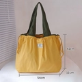 Eco-friendly yellow foldable shopping bag with green straps and 54cm large capacity size - XL Ginger