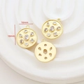 Detailed macro of 16mm gold plated vintage round pendant with inlaid zircon stones - Zirconia Round Plate
