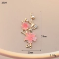 Detailed macro view of cherry blossom pendant with gold alloy, resin and white pearls - Pink Cherry Blossom (3909)