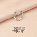 Detail view of heart-shaped silver pendant with size specs on pink velvet background - Silver
