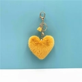 Portachiavi a cuore in peluche giallo con anello dorato e nappa su sfondo blu - Giallo