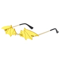 Quirky bat-shaped sunglasses with yellow lenses and gold metal frames in 45-degree view - Yellow