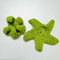 Handmade crochet accessories featuring grass green starfish and flower shapes in yarn - Rose Calyx