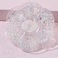 Macro detail of aurora resin bears and pearls for nail art in a plum storage box - MH-10 Aurora Bear 6 Styles