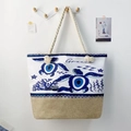 Detail of canvas beach bag with turtle evil eye print, jute bottom and rope handles - Sea Turtle Totem Decor