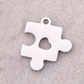 Silver puzzle piece pendant with heart cutout in mirror polished stainless steel - Puzzle Heart / Steel