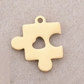 Golden puzzle piece pendant with heart cutout in mirror polished stainless steel - Puzzle Heart / Gold