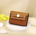 Detail of compact two-tone brown card wallet with silver buckle and stitch texture - Dark Brown