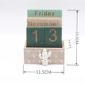 Wooden perpetual calendar with green cactus decor and date blocks on white background - Cactus Style