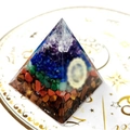 Crystal energy pyramid with colorful gravel layers on a zodiac constellation mat - All Stone Constellation Mat / Small