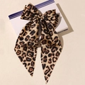 Elegant satin bow hair clip with leopard print design on a decorative display box - Yellow Leopard
