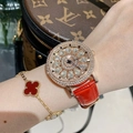 Detail of luxury rotating floral diamond watch with red leather strap and clover bracelet - Red Strap with White Rhinestones