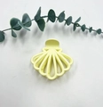 Elegant shell shaped hair claw clip in pale yellow with a hollow line cutout design - Yellow