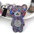Llavero de oso con diamantes de colores, borla negra y cascabel sobre fondo blanco - Grande / Negro Con Cristales de Colores