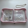 Macro detail of pink loose-leaf jewelry storage book with transparent PVC zipper bags - Pink Zipper Binder (No Pages)
