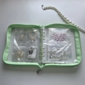 Detail of mint green jewelry binder with 6-grid transparent PVC zipper pockets - Green Zipper Binder