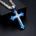 Detailed macro shot of silver stainless steel cross pendant with blue inlay and diamond accent - Necklace Set / Blue