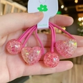Detailed view of pink resin hair ties with glitter heart and sphere charms - Rose Red
