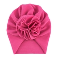 Detail of rose pink baby turban hat showing textured waffle fabric and large flower decoration - One Size / No. 17 Rose Red