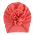 Detail of baby turban hat featuring waffle knit fabric and layered fabric flower - One Size / No. 15 Watermelon Red