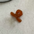 Detailed view of an amber acetate hair claw clip with golden Sunshine Handmade text - Brown (Mini Cross)