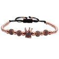 Detail of rose gold crown charm and blue zircon beads on an adjustable cord bracelet - Rose Gold Blue Zircon Crown Bracelet