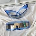 Detail of blue Y2K cat-eye sunglasses with silver mirror lenses and futuristic frame - One-piece Semicircle Blue Silver Mirror