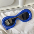 Detail view of bold blue polygonal frames with black lenses on a white minimalist texture - One-piece Royal Blue Futuristic