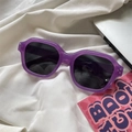 Detail of square purple resin sunglasses with dark lenses on a white satin background - Diamond / Purple