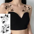 Sketch-style black and white flower temporary tattoo showing rose design on shoulder - Pattern BK-005