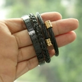 Detail of Roman numeral engraved bangle and braided steel rope bracelets for men - Round End Black-Gold Set