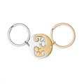 Détail de breloques chien emboîtées en or et argent en forme de yin-yang pour couples - Paire de Chiens Souriants Or et Argents / Or/Argent